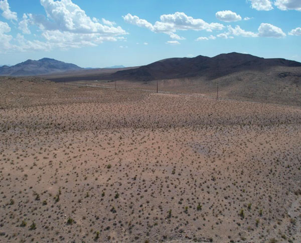 Transmission lines running across vast dry lands Transmission lines running across vast dry lands